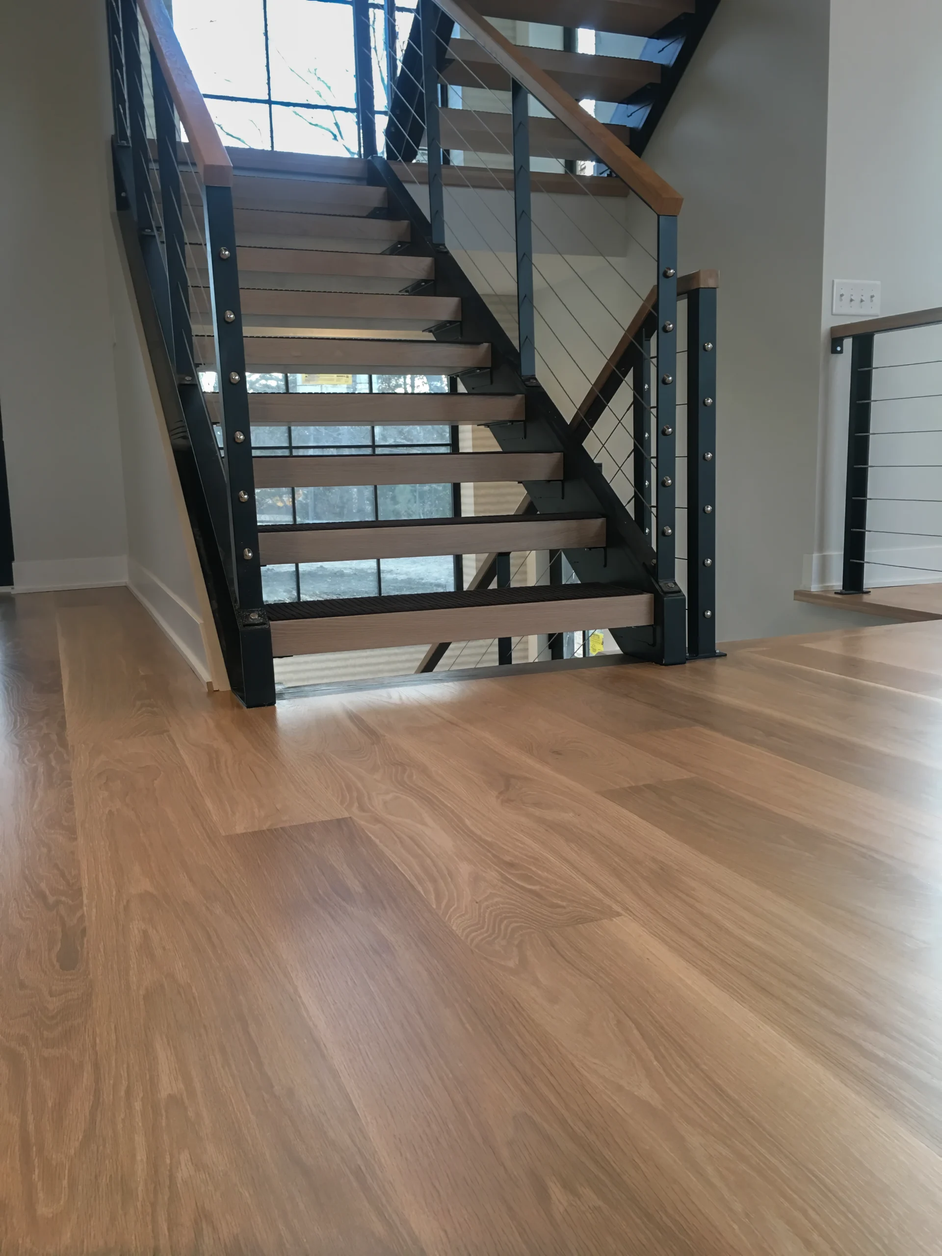 Wide plank white oak and custom stair work in Lincoln, NE